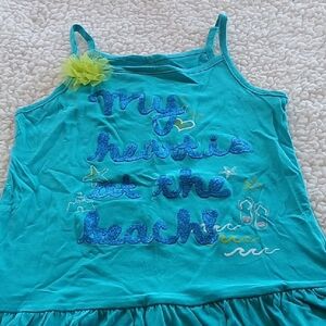 Blue Tank Top with Spaghetti Straps and Playful Design